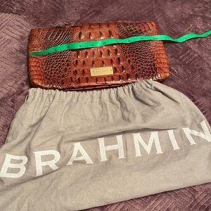 Brahmin small flat wristlet exterior excellent condition.Barely used. Like new